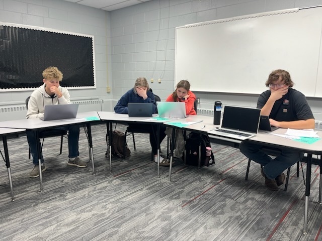 4 seniors completing college applications