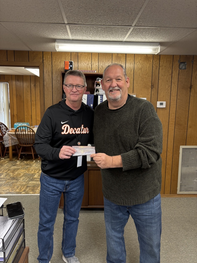 Two Men holding a check