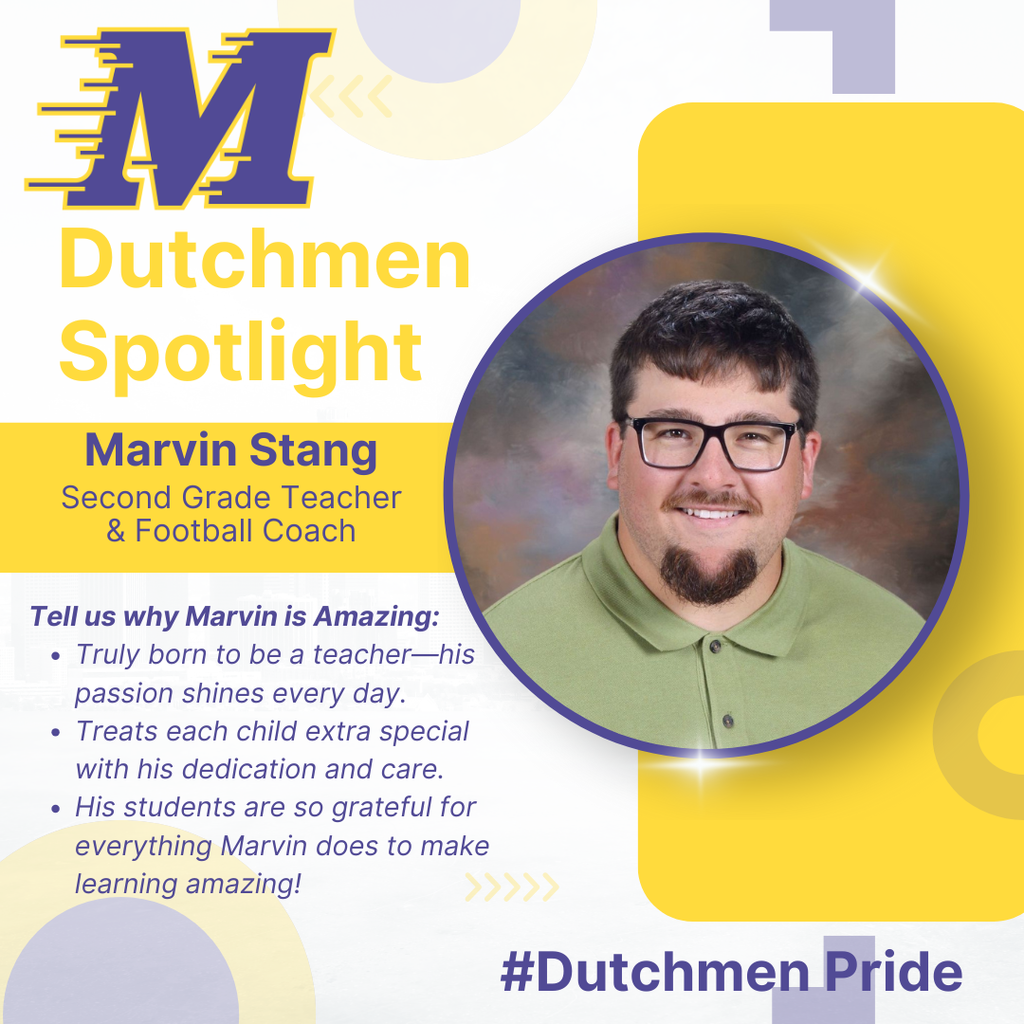 man with green polo shirt glasses dark hair and goatee