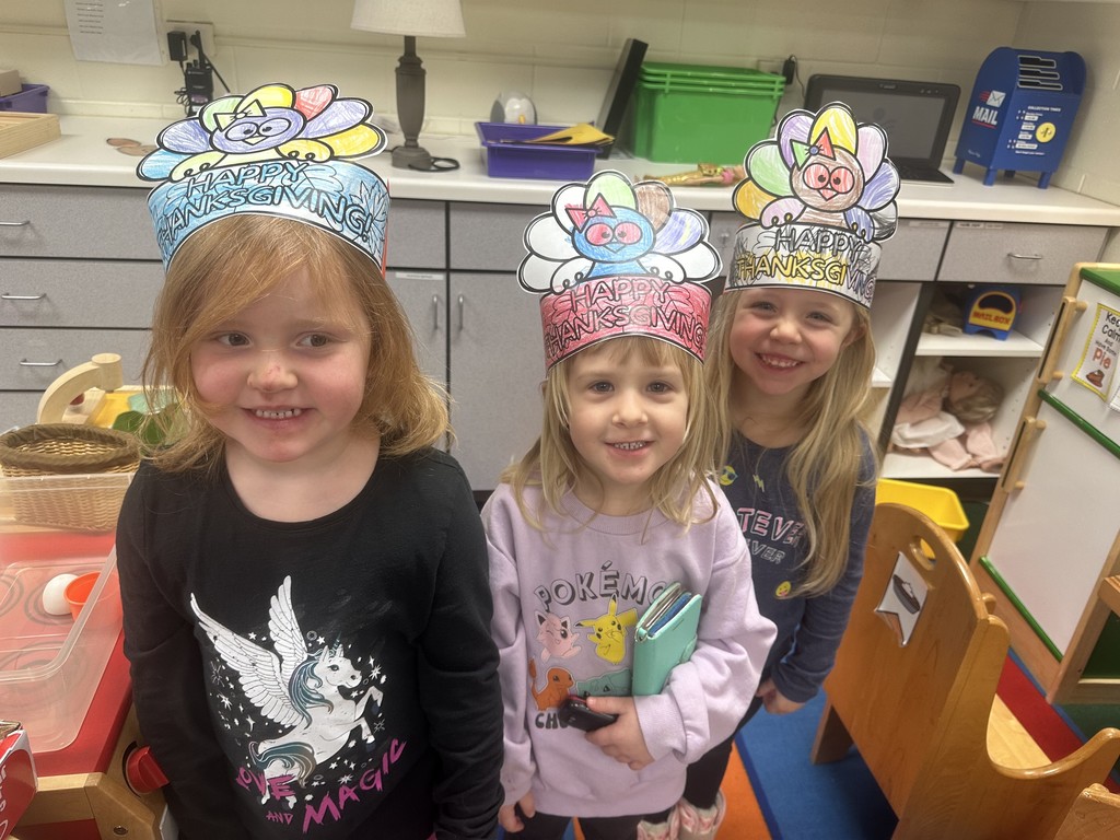 3 girls with turkey crowns and big smiles