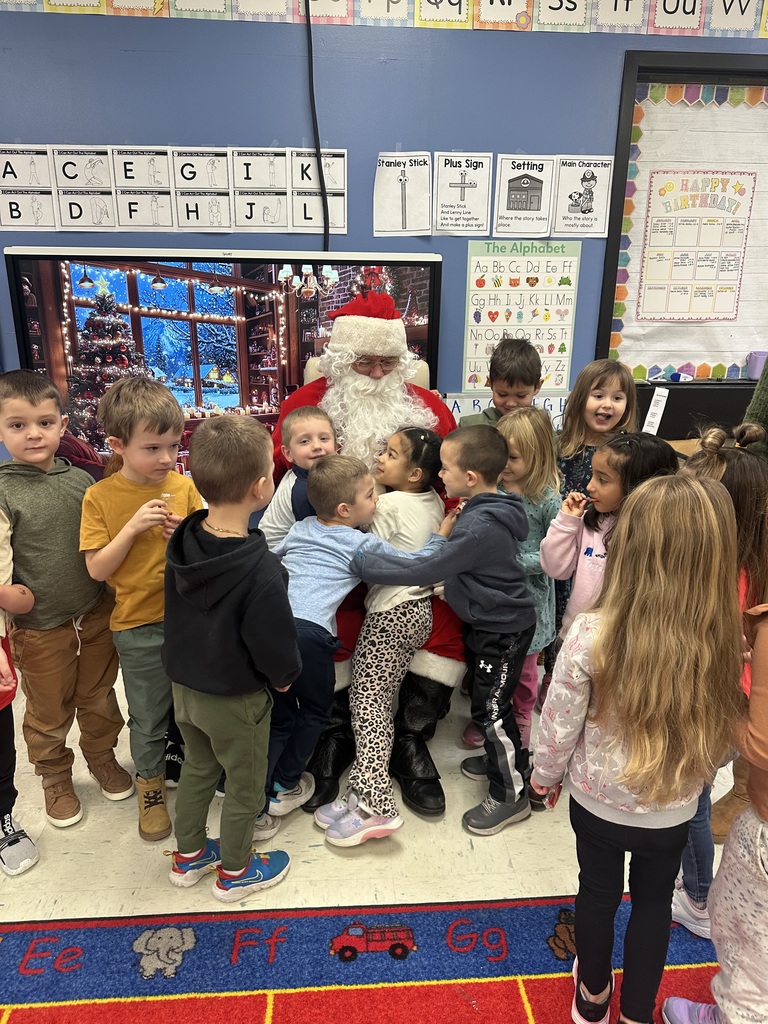 preschool age kids hugging santa