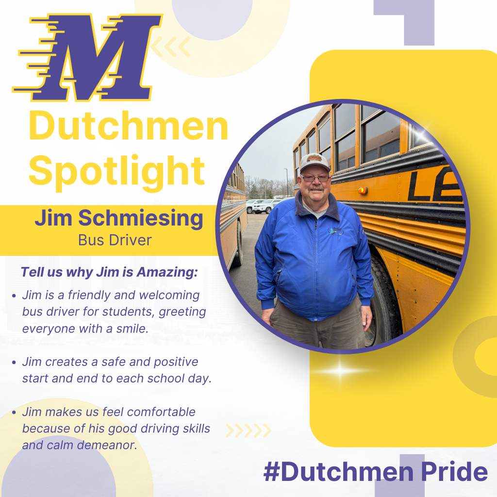 man in blue jacket glasses, hat, facial hair  standing by a bus