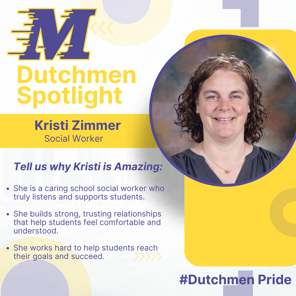 Woman with brown curly hair, grey shirt and a necklace smiling in a school photo