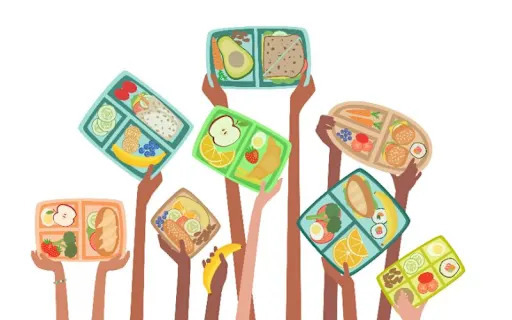 kids holding up lunch trays