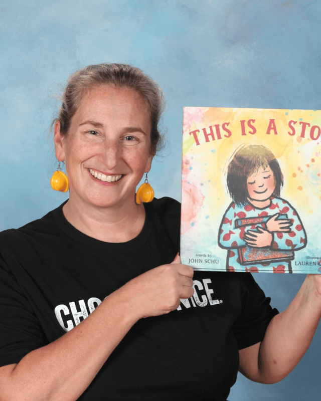 Henry P. Clough Elementary School Principal Liz Garden holds up a copy of the children's book, "This Is a Story," by author John Schu, who is visiting the school on Friday, Sept. 12. (Photo Courtesy Mendon-Upton Regional School District)