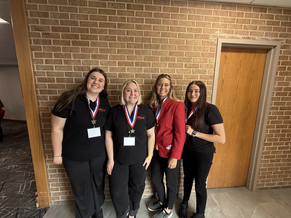 Adie R., Grace G., Ella R., and Carol M. with their gold medals!