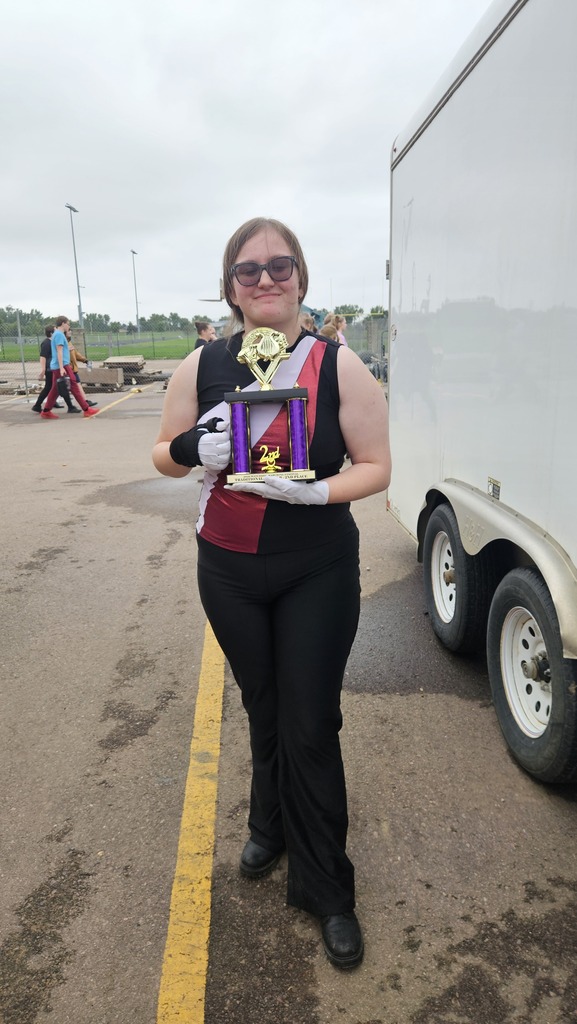 drum major holding 2nd place trophy 