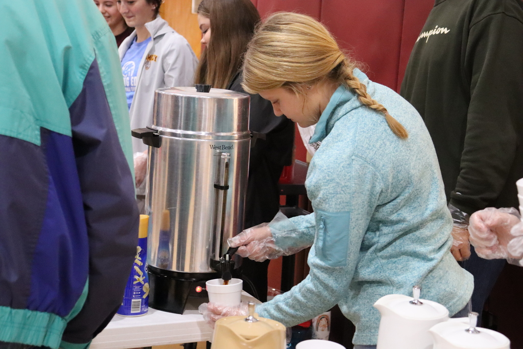 Maggie Miller serving coffee