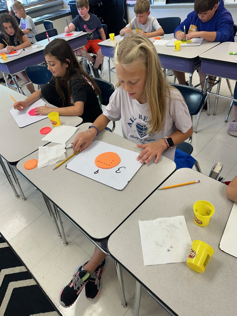 Photo shows Zitzman Elementary 3rd graders bringing multiplication to life as they learn how to solve problems.