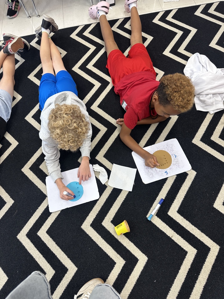 Photo shows Zitzman Elementary 3rd graders bringing multiplication to life as they learn how to solve problems