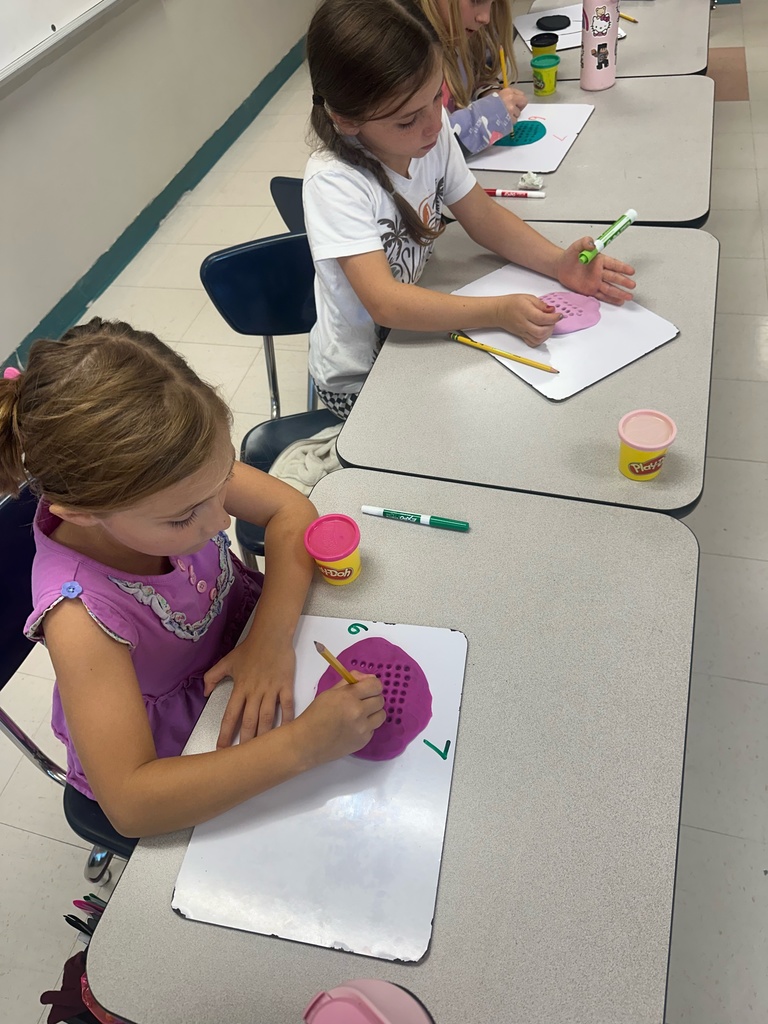 Photo shows Zitzman Elementary 3rd graders bringing multiplication to life as they learn how to solve problems.