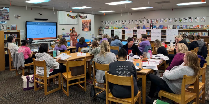 Photo shows nurses and counselors in professional learning