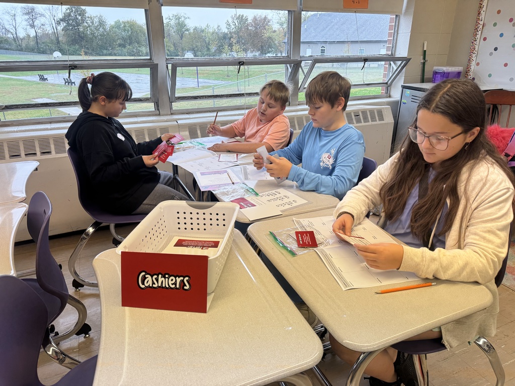 The photo shows Pacific Intermediate 6th graders using a real-world approach to learn math.