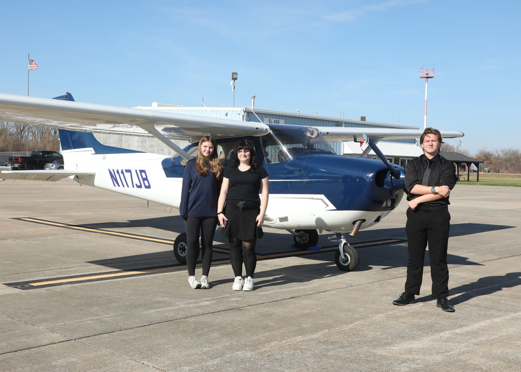 The photo shows three Pacific High School students who recently completed the SOAR into STEM aviation program.