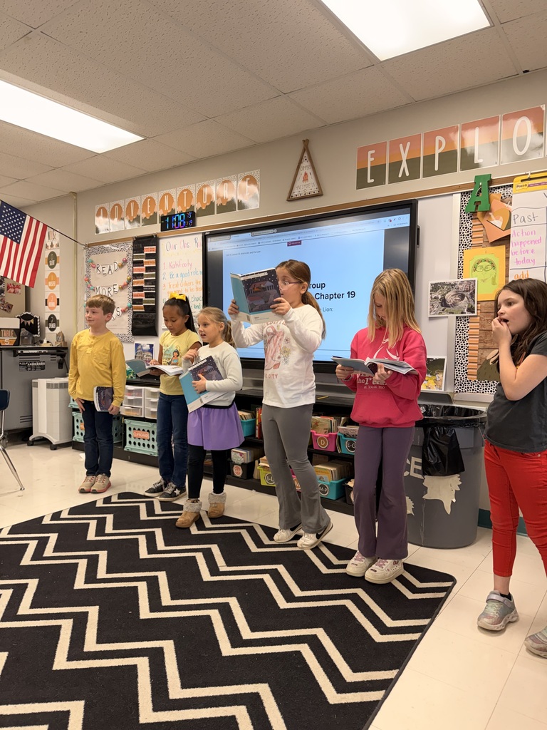 The photo shows third grade students at Zitzman Elementary performing readers theater