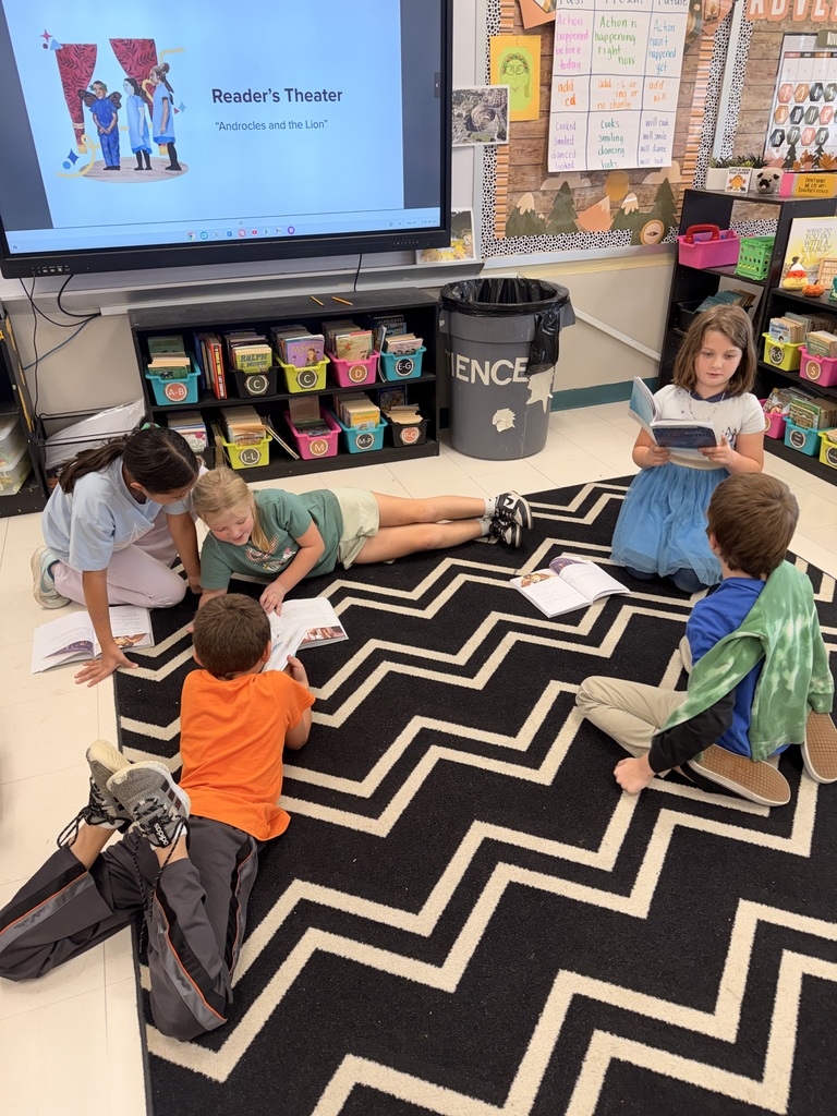 The photo shows third grade students at Zitzman Elementary performing readers theater