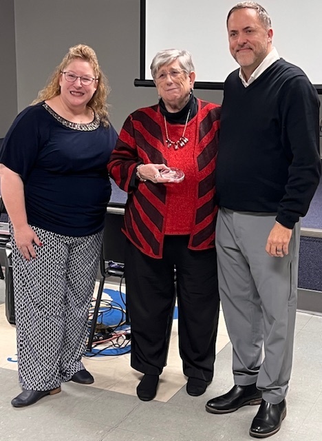 The photo shows the Pacific Chamber of Commerce honoring an outstanding leader from our school community