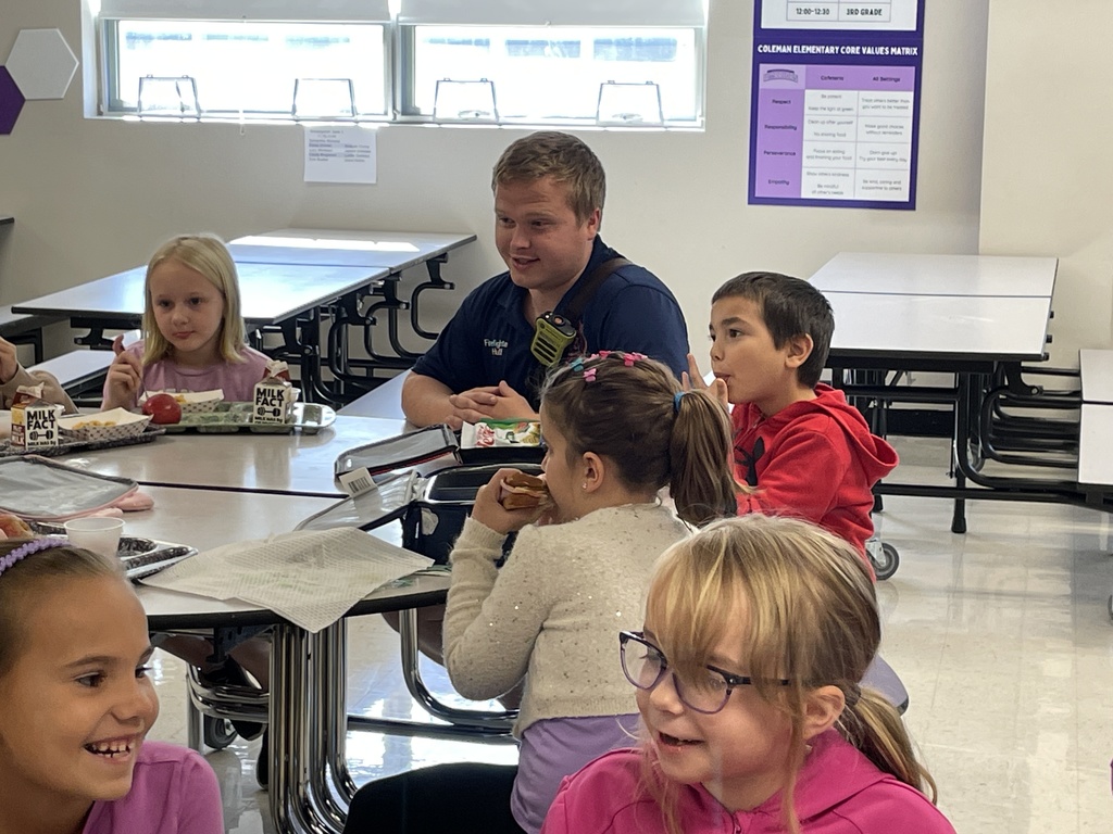 Photo shows a lunchtime visit from the Boles Fire Department to Coleman Elementary 