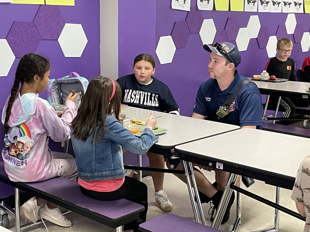 Photo shows a lunchtime visit from the Boles Fire Department to Coleman Elementary 
