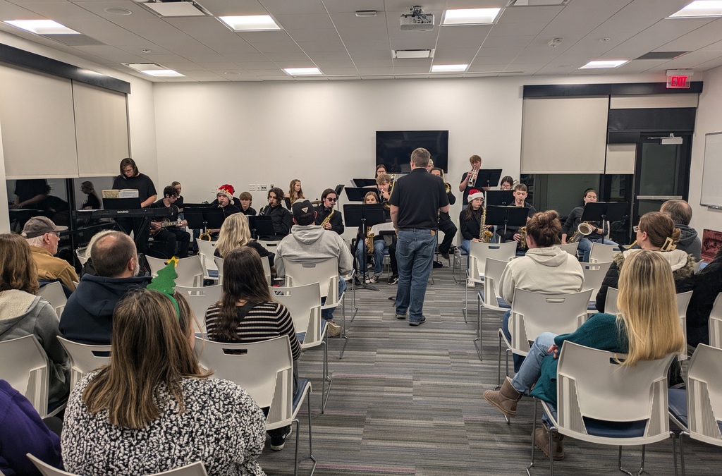 The photo shows the PHS Jazz Band performing at the Scenic Regional Library.