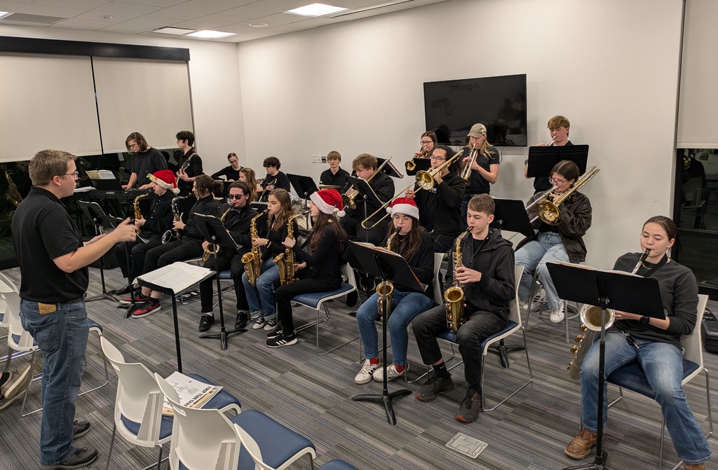 The photo shows the PHS Jazz Band performing at the Scenic Regional Library.
