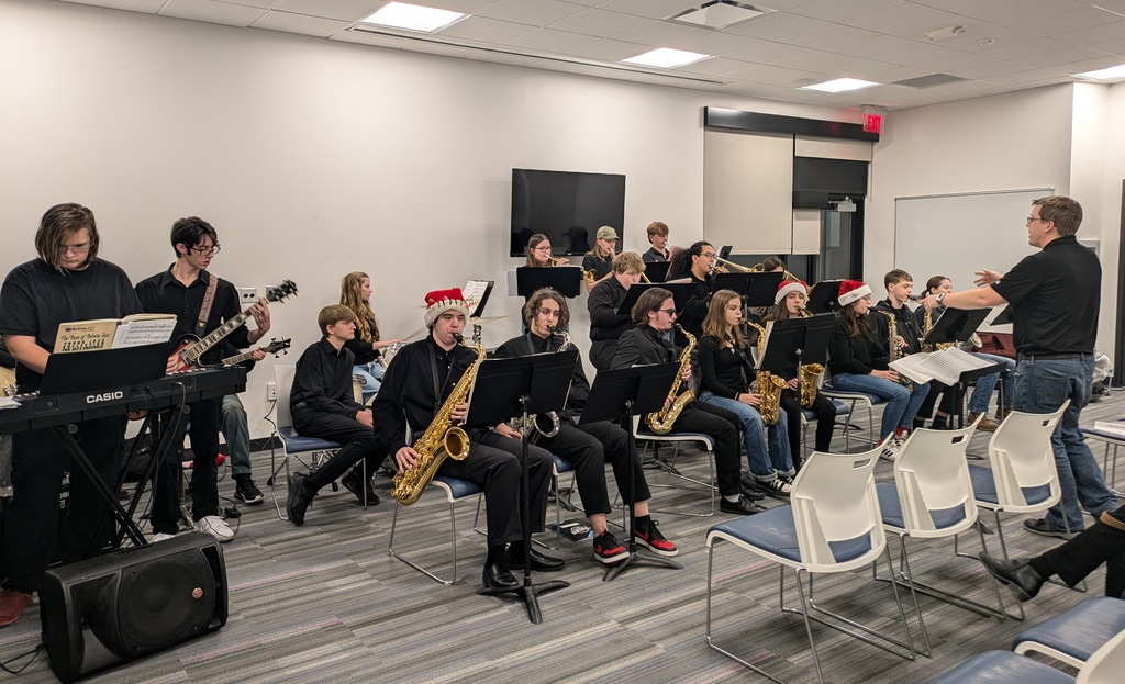 The photo shows the PHS Jazz Band performing at the Scenic Regional Library.