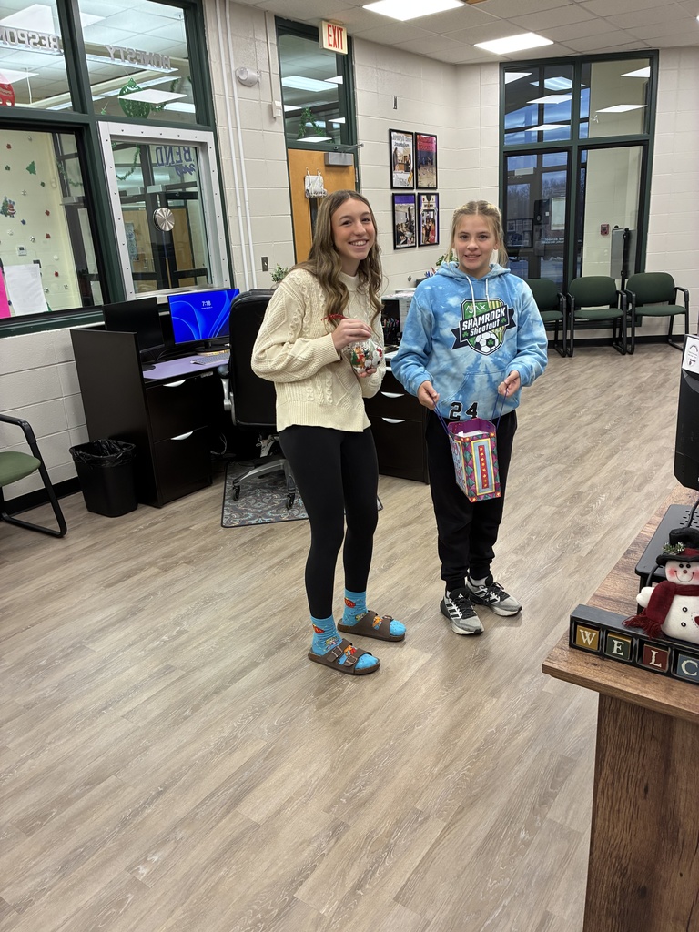 The photo shows Riverbend Middle School students in the Exploring Community Service class spreading holiday cheer throughout the community