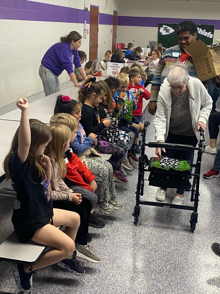 Photo shows Southpoint Assisted Living delivering special treat bags to kindergarteners at Zitzman Elementary