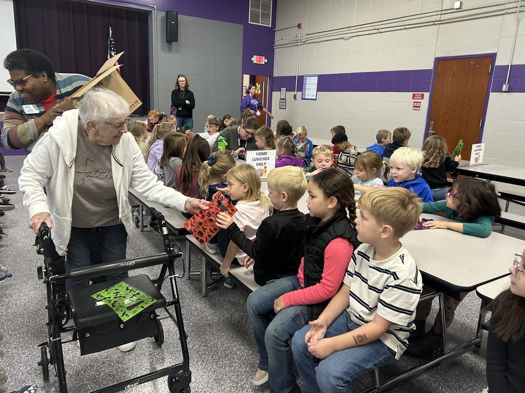 Photo shows Southpoint Assisted Living delivering special treat bags to kindergarteners at Zitzman Elementary