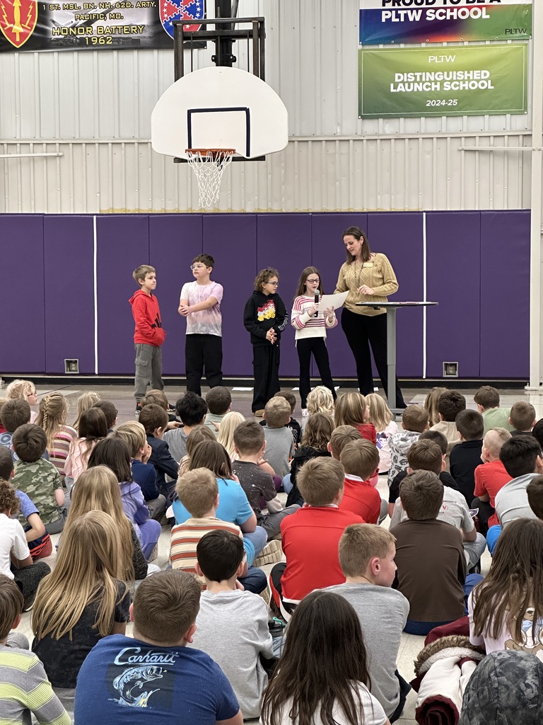 Presenting awards to the classrooms. 