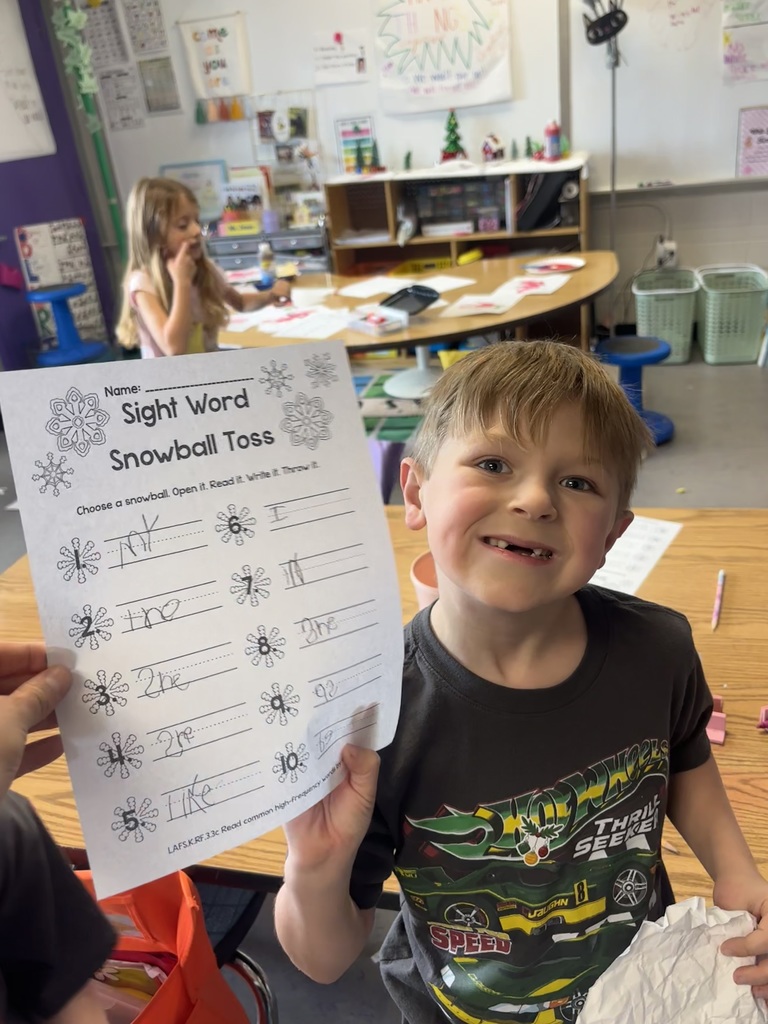 The photo shows kindergarten students at Coleman Elementary practicing their sight words with a fun snowball activity