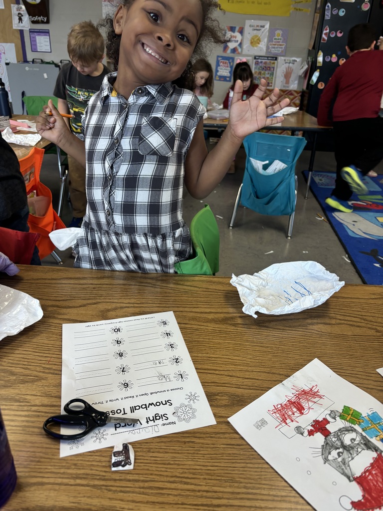 The photo shows kindergarten students at Coleman Elementary practicing their sight words with a fun snowball activity