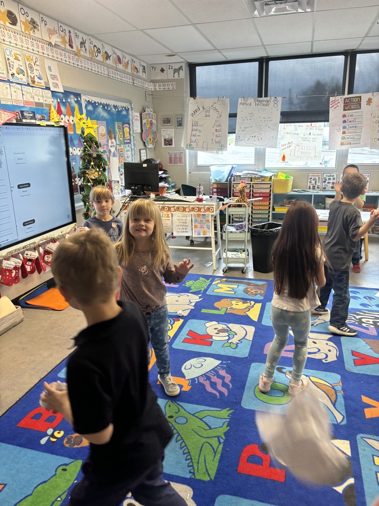 The photo shows kindergarten students at Coleman Elementary practicing their sight words with a fun snowball activity