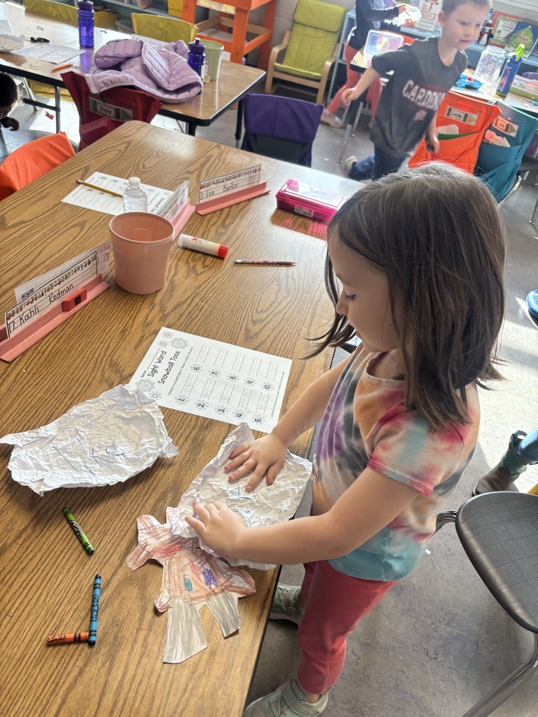 The photo shows kindergarten students at Coleman Elementary practicing their sight words with a fun snowball activity