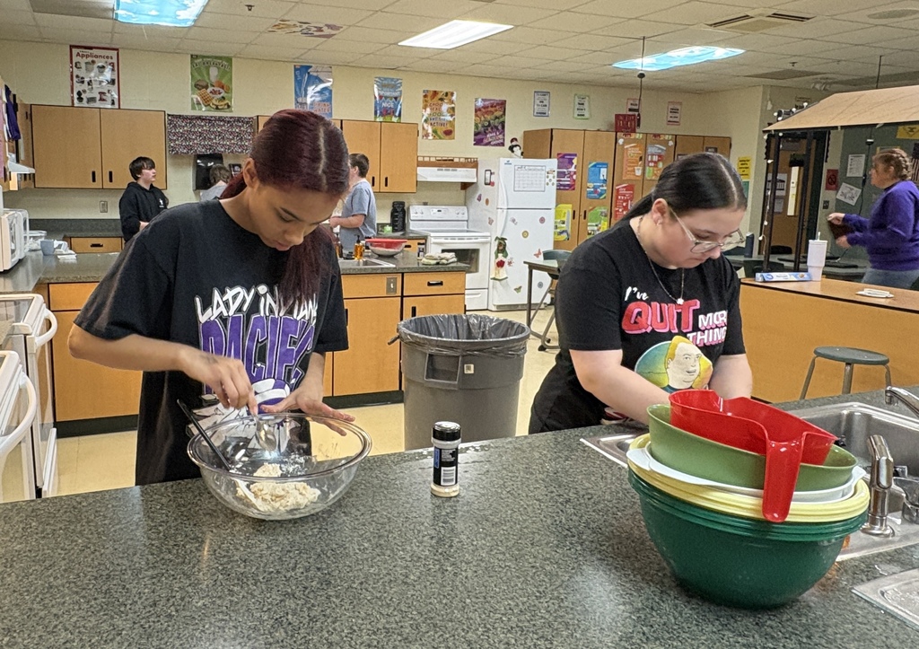 Middle School students practicing kitchen safety. 