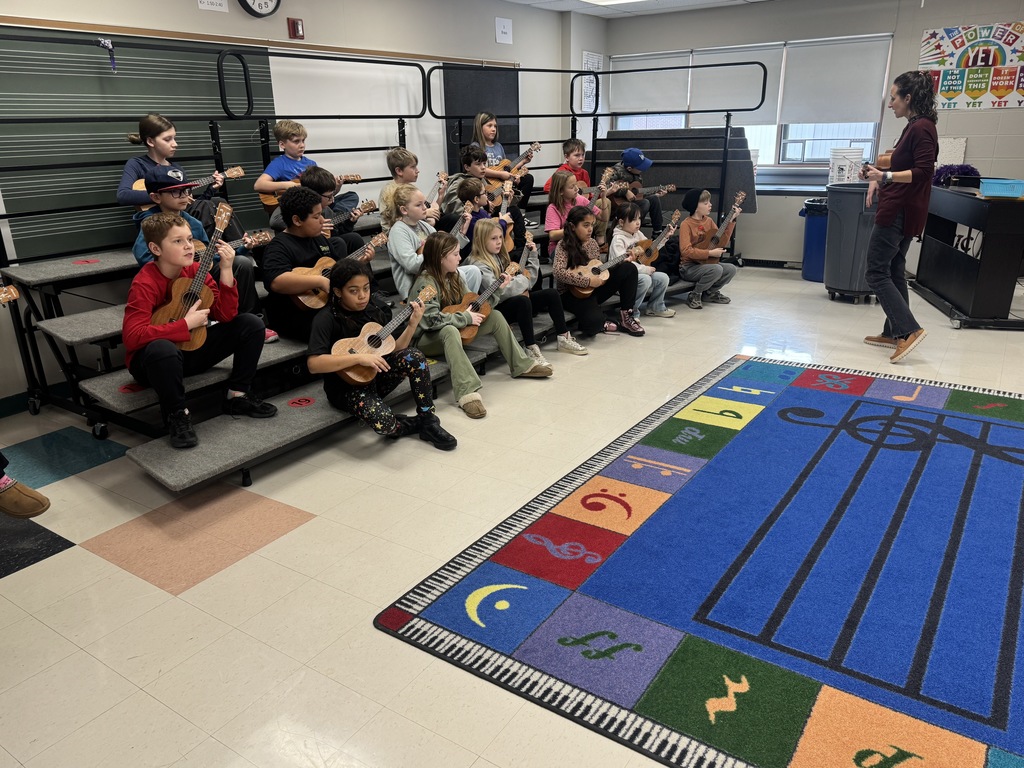 Students practicing their ukuleles in music class with Mrs. Franzen.