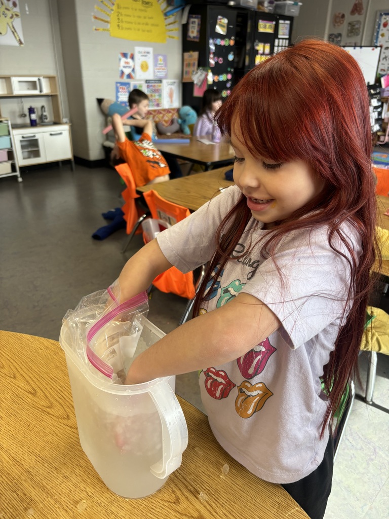 Students using a “blubber” layer by placing one hand in a glove inside a sealed bag.