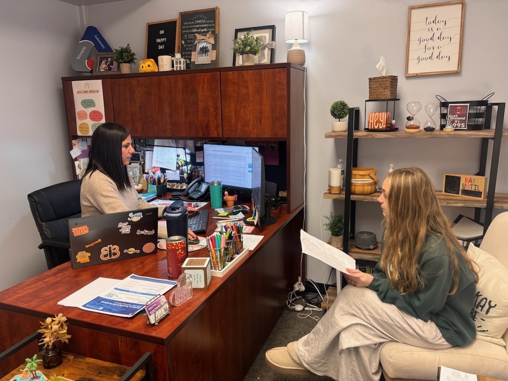 Pacific High School counselors working with high school student. 