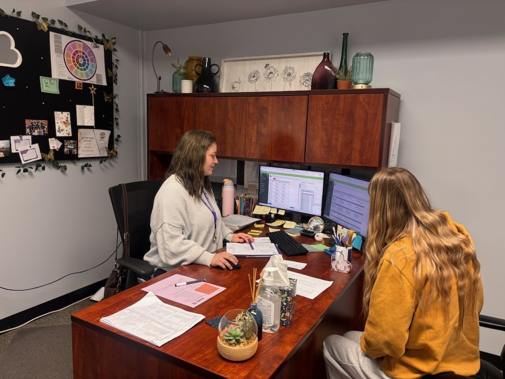 Pacific High School counselors working with high school student. 