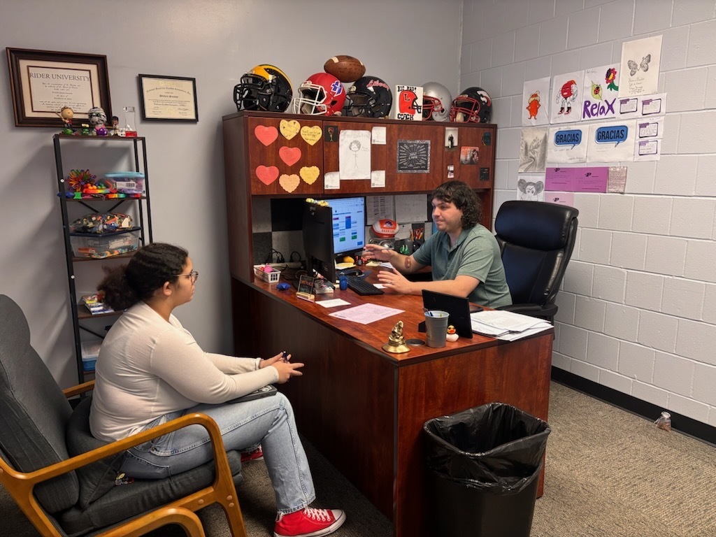 Pacific High School counselors working with high school student. 