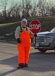 Paraprofessional working a crosswalk.