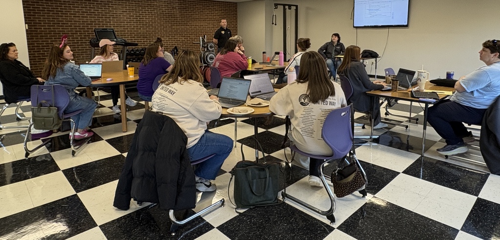 Group of school counselors doing live working session.