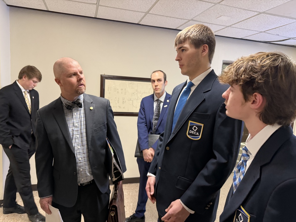 DECA students speaking with representatives at the Missouri State Capitol.