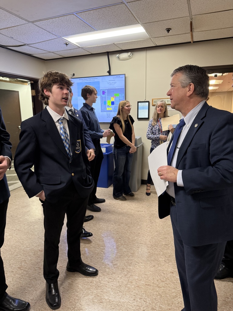 DECA students speaking with representatives at the Missouri State Capitol.