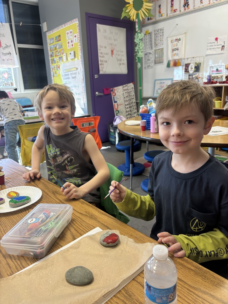 Elementary students working on painting rocks.
