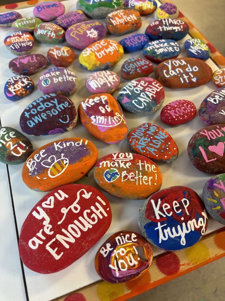 Students painted rocks with inspirational sayings on them.