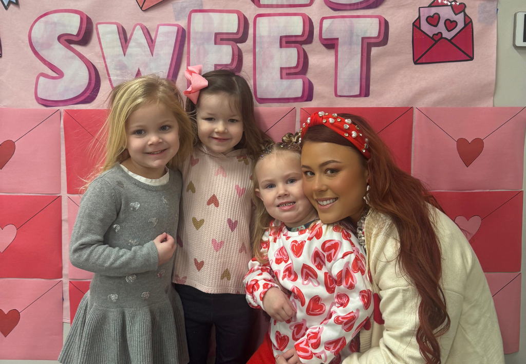Class photo next to "Our Class is Sweet" Poster.