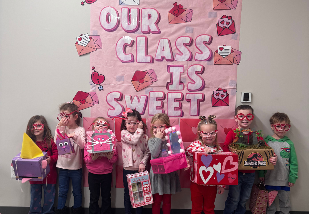 Class photo next to "Our Class is Sweet" Poster.