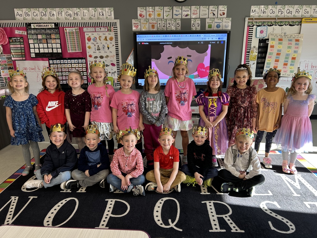 Students dressed up as Kings and Queens in an elementary classroom.