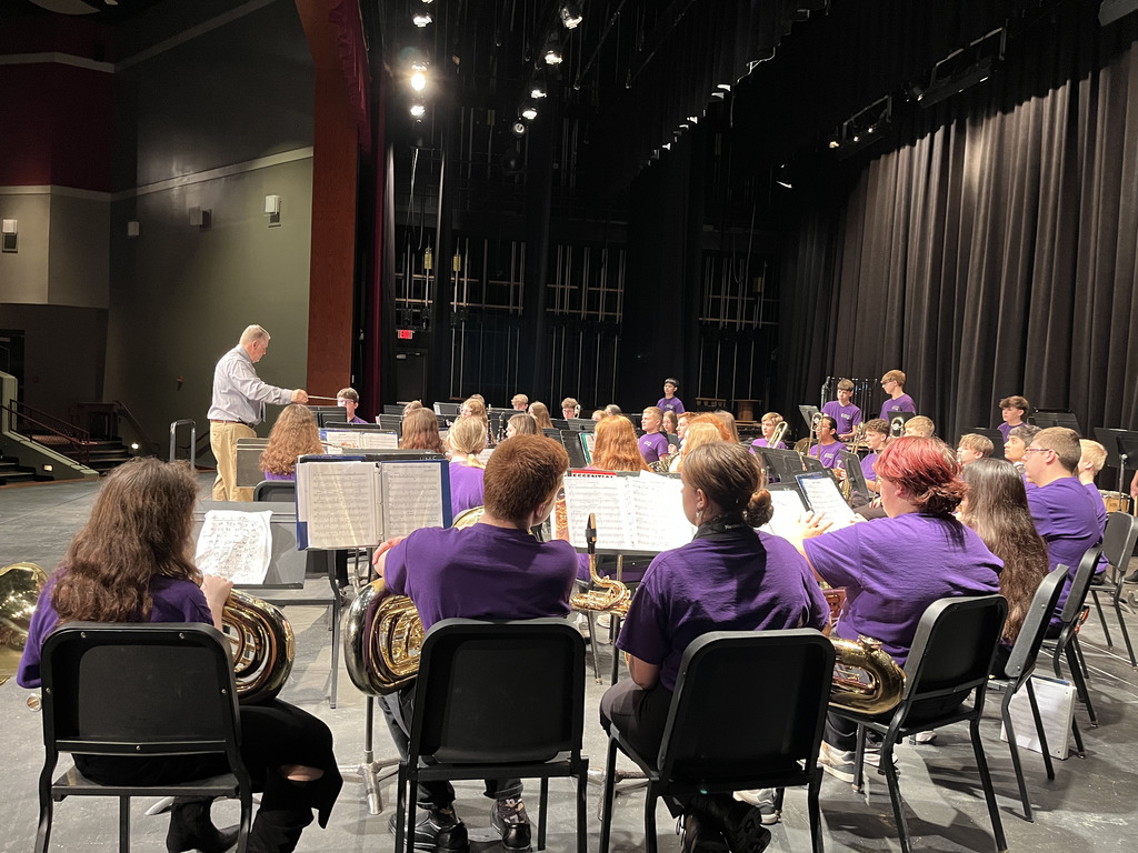 Middle school ensemble group with music director. 